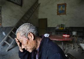 Chinese farmer in village with arsenic pollution