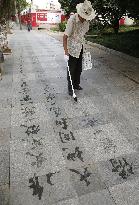 Ephemeral writing of Chinese characters on China street