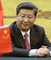 Chinese leader Xi sits in Beijing's Great Hall of People
