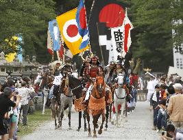 Armed warriors pray for reconstruction from nuclear disaster