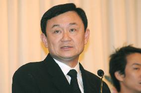 Ousted premier Thaksin returns home to face corruption charges