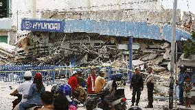 Collapsed car showroom in Sumatra devastated by M8.4 earthquake