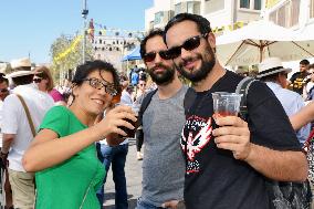 People drink Palestinian beer at West Bank festival