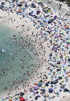 Crowded beach in sizzling Japan