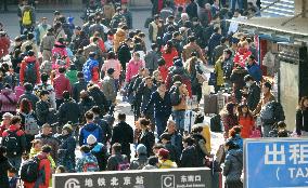 People returning home for Chinese Lunar New Year
