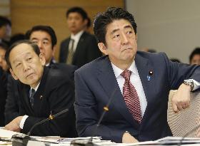 Abe watches performance of voice translator for use at 2020 Olympics