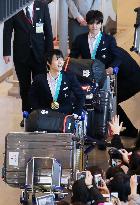 Olympics: Japanese athletes return home