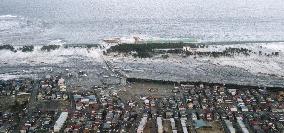 Yuriage coastal area being hit by tsunami