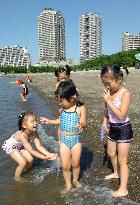 Children take dip in Tokyo's Daiba