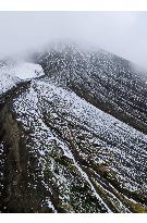 Mt. Asahi in Hokkaido covered with year's first snow