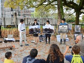 Hiroshima Univ. students studying A-bomb history excavate tiles