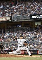 Tanaka wins 6th game with 7 solid innings