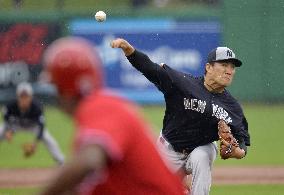 Tanaka pitches 4 innings in rained-out game against Phillies