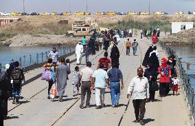 Iraq's Mosul, month after being liberated