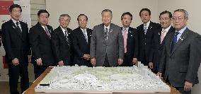 Tokyo Olympics organizers, corporate supporters with stadium scale model