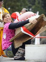 Giant rice cake lifting competition held in Kyoto