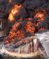 Burning tank at oil refinery in Hokkaido collapses