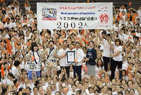 Guinness record set in Japan for most people twirling batons