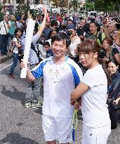 Ex-Japanese swimmer joins torch relay for Rio Paralympics