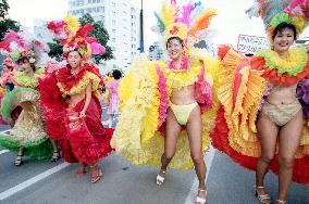 Scantily dressed samba dancers dancing in Kobe Festival