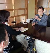 Tsunami-hit city library compiles victims' memoirs in English