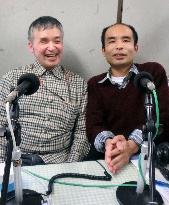 Disabled duo cheer up quake-hit area as radio personalities