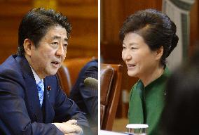 Abe, Park hold 1st talks amid row over "comfort women" issue