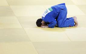 Olympic scenes: Gold medalist judoka bows on tatami mat