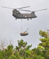 SDF helicopters airlift equipment to build U.S. helipads in Okinawa