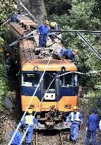 Train hits leaning utility pole in central Japan