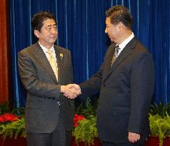 Japanese PM Abe, Chinese Pres. Xi hold talks for 1st time