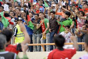 Afghans cheer own soccer team in World Cup qualifier against Japan