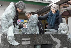 Statues of "yokai" monsters cleaned ahead of New Year