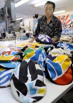 Caps made from tsunami-hit fishermen's flags