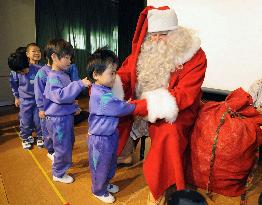 Santa cheers up children in Iwate Pref.