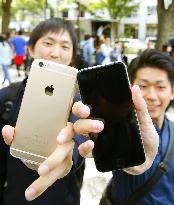 Apple's new iPhone models go on sale in Japan