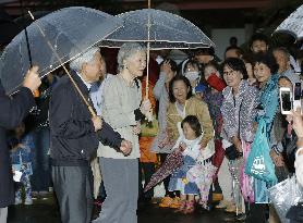 Emperor, empress visit flood-hit area