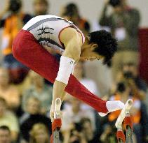 Tomita takes silver in parallel bars at worlds