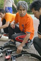 Experts Usui checks prosthetics for athletes