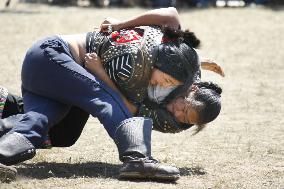 Female wrestlers fight in Mongolia's Naadam sport festival