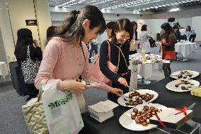 Japanese women sample chocolates for gifts ahead of Valentine's Day