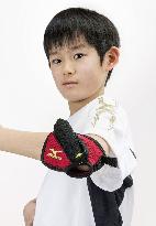 Elbow sleeve device on sale to help kids improve running form