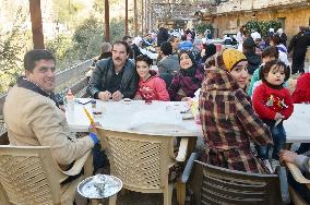 Syrian citizens enjoy meals at picnic facility in Damascus