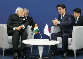 Abe meets Modi on sidelines of climate summit