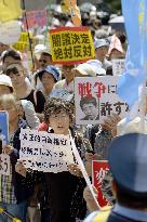 2,000 protest in Tokyo over security policy change