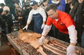 Dried giant squid grilled for tasting in Toyama Pref., central Japan