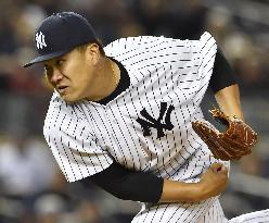 Yankees' Tanaka gets season's 1st win