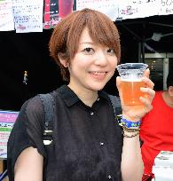 Woman drinks craft beer with spice