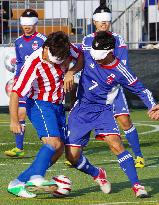 Blind footballer play at futsal courts in Tokyo