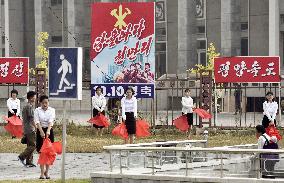 People of Pyongyang seen from bus window